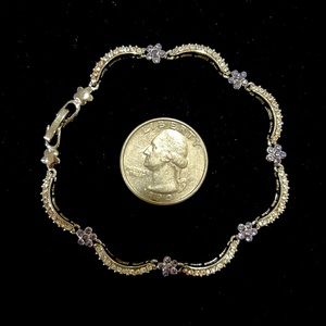 Bracelet silver w/ CZ (diamond like) with blue small flowers.